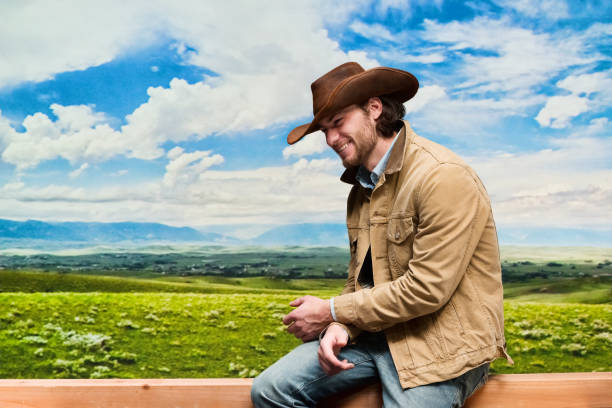 Adult man in cowboy hat walking on dirt road, Almeria, Spain