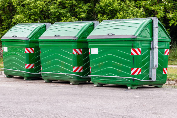 istock Three green recycle bins in row, outdoors. Environment and pollution concept. 1162597444