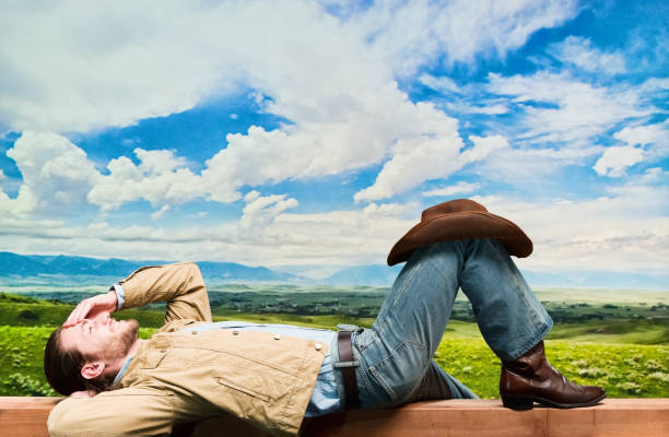 istock Handsome cowboy wearing denim jacket and jeans and cowboy hat 1162599279