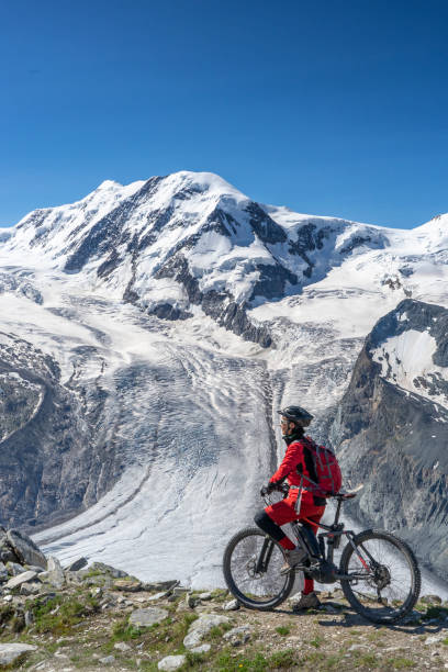 istock woman mountain biking on the Gornergrat, Zermatt 1162601832