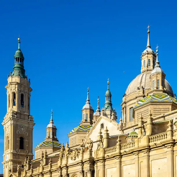 Architecture details of the cupolas and tower bell of Cathedral of Our Lady of the Pillar in Zaragoza, a fine example of Baroque style architecture