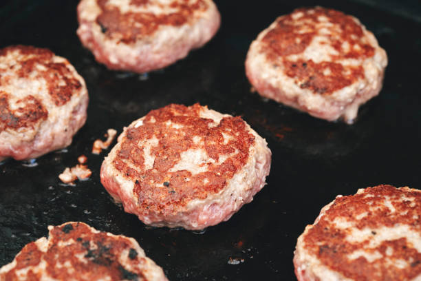 istock Beef Patties for Preparing Burger on BBQ Grill 1162604298