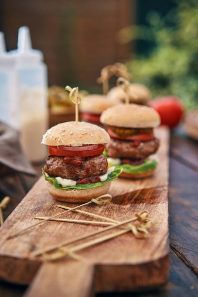 istock Mini Burgers with Tomato, Onion and Lettuce 1162604304