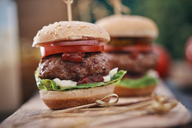 istock Mini Burgers with Tomato, Onion and Lettuce 1162604314