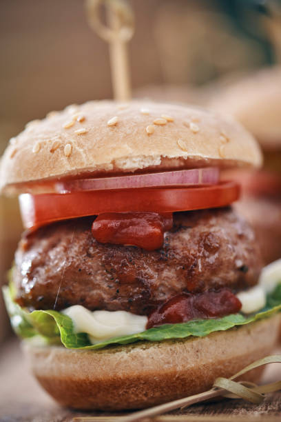 istock Mini Burgers with Tomato, Onion and Lettuce 1162604316