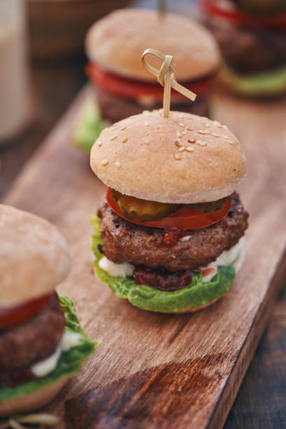 istock Mini Burgers with Tomato, Onion and Lettuce 1162604317