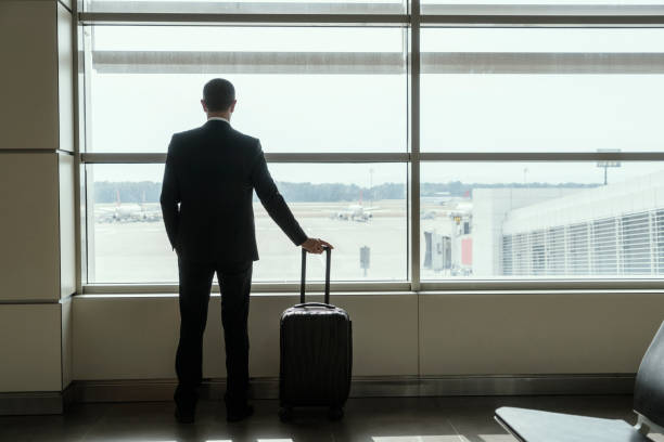 istock Businessman at airport 1162604421