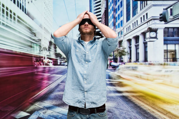 istock Handsome man with blindfold on in the city 1162605766