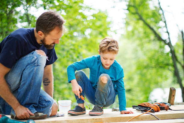 istock Father and son working togethe 1162605845
