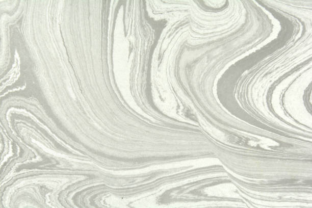 istock Mix of a white and black paint, closeup. Abstract marbling texture. Handmade ebru technique. 1162608294