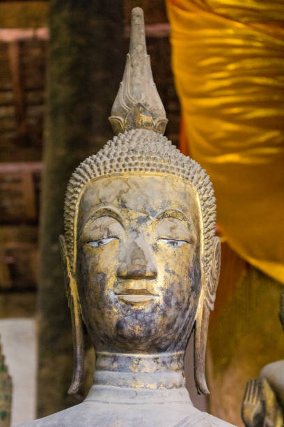 istock Buddha statue art in various temples in Laos. 1162608395
