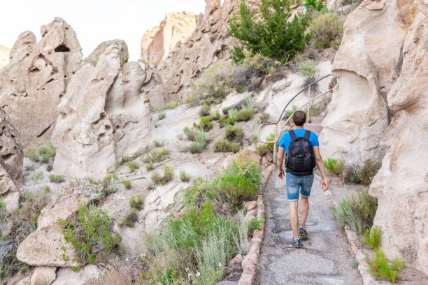 istock Park with man hiker walking on Main Loop trail path in Bandelier National Monument in New Mexico 1162609581