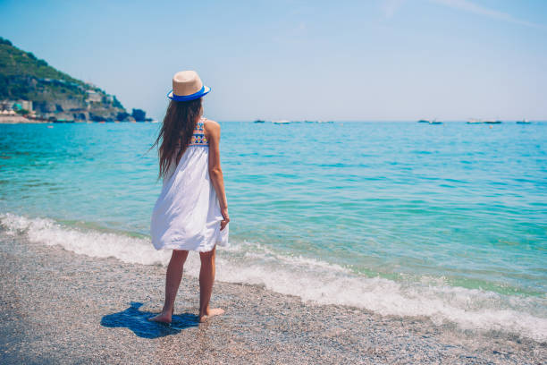 istock Cute little girl at beach during summer vacation 1162609585