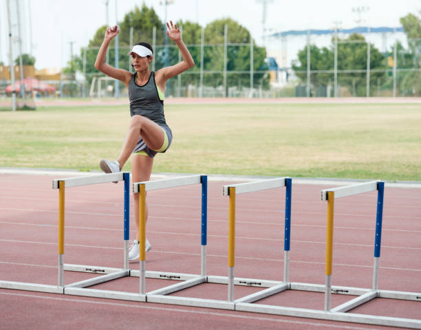 istock Female high jumper of a university athletic team in training 1162609876