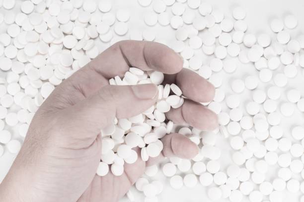 istock Suicide Pills,  Pills, tablets in dead man's hand by overdosing on medication. 1162610592