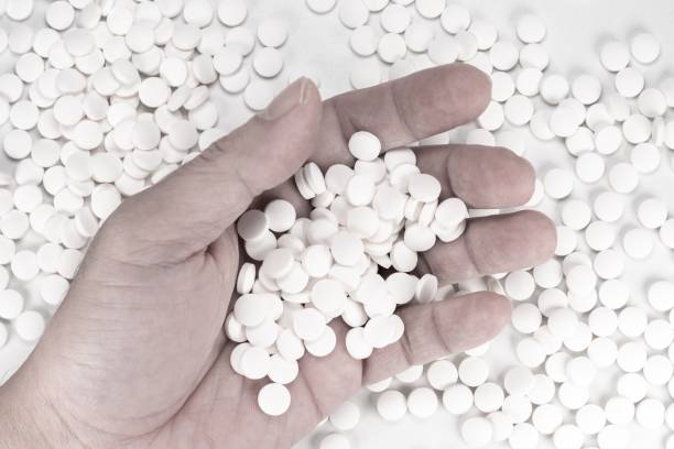 istock Suicide Pills,  Pills, tablets in dead man's hand by overdosing on medication. 1162610595