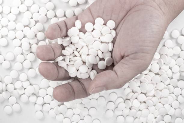 istock Suicide Pills,  Pills, tablets in dead man's hand by overdosing on medication. 1162610599