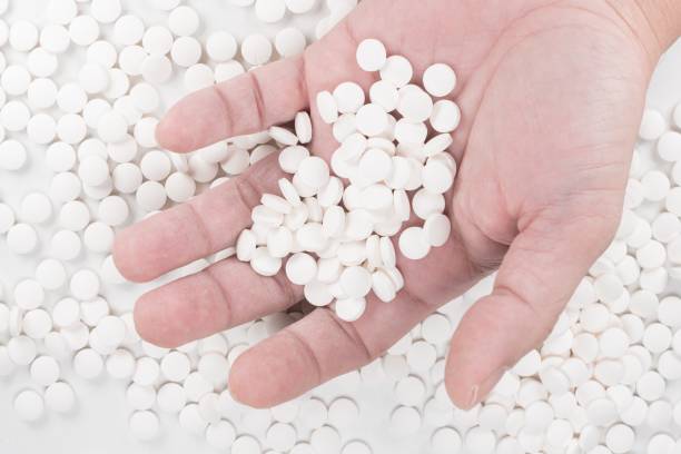 istock Suicide Pills,  Pills, tablets in dead man's hand by overdosing on medication. 1162610602