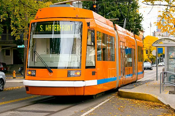 The Portland Streetcar, an electric trolley, makes its way through the Pearl District of Northwest Portland, Oregon.