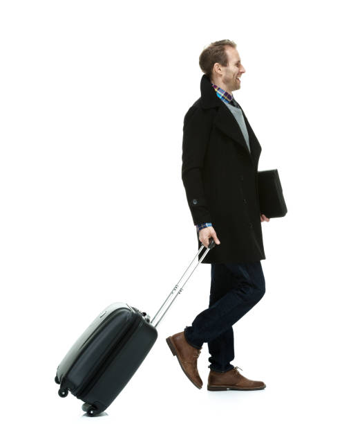 istock Handsome man wearing a coat and sweater and neck tie and jeans 1162613355