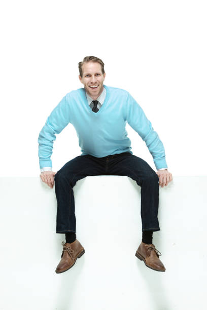 istock Handsome man wearing a sweater and neck tie and jeans 1162613576