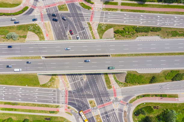 istock Traffic trails on highway intersection. Aerial View. Green Forest 1162614533