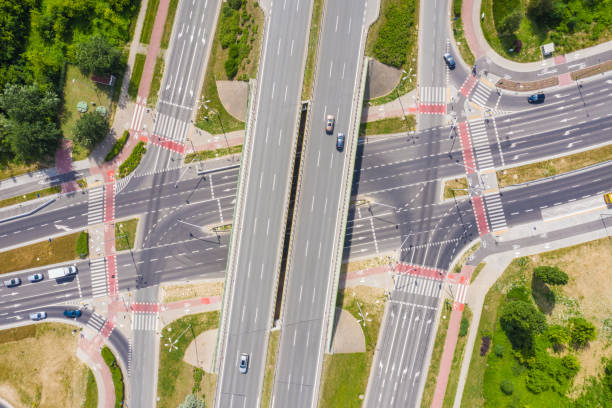 istock Traffic trails on highway intersection. Aerial View. Green Forest 1162614536