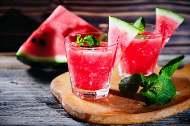istock Watermelon Mojito with Watermelon Garnish on wooden table 1162615958