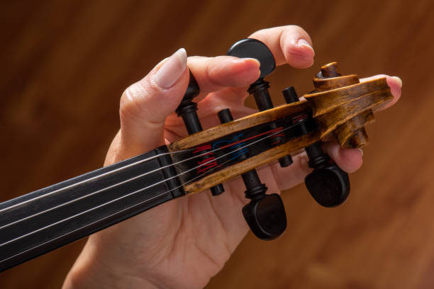 istock Woman playing the violin showing hands holding the bow 1162619592