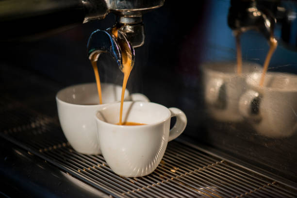 istock The Cappuccino Cups In The Machine 1162620496