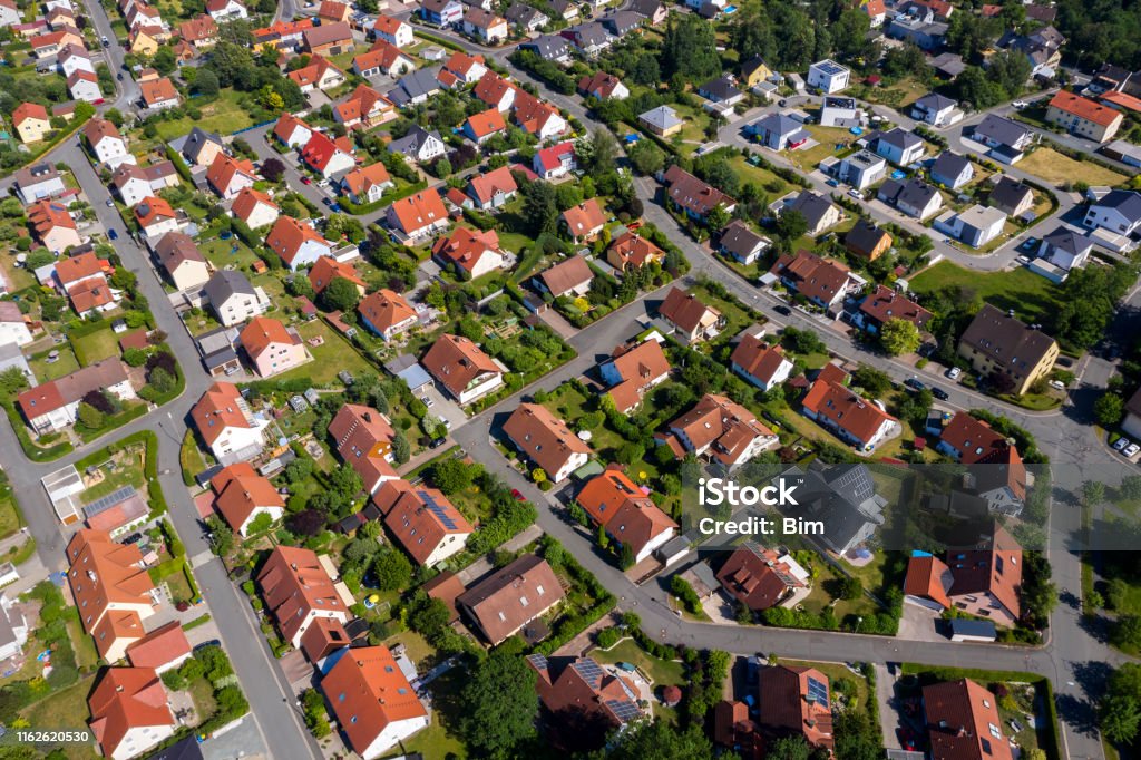 Aerial view above suburb houses Aerial view above suburb homes in residential neighborhood. House Stock Photo