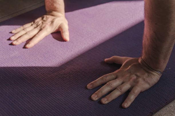 Illustration of a young man sitting in deep meditation.Yoga meditation by man on the ocean at sunrise with purple color-3D Rendering-3D Illustration