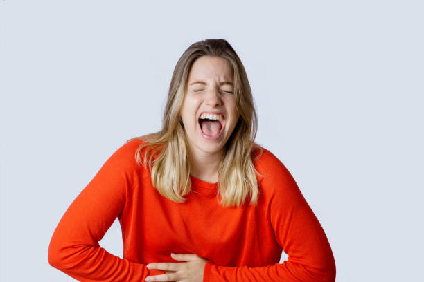 istock Young woman laughing. 1162621628