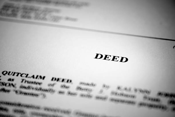 istock Deed for real estate transfer or transaction contract paper 1162621964