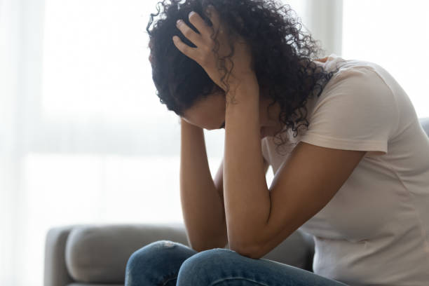 istock Sad hopeless black woman sit alone at home feeling depressed 1162624174