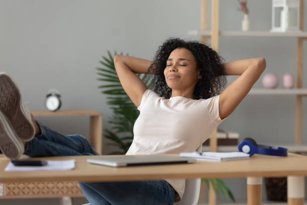 istock Happy african girl student relaxing finished study sit at desk 1162624200