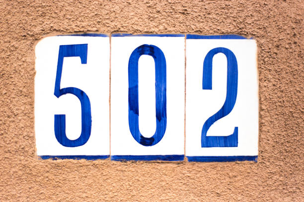 istock Ceramic Number 502 Street Address Tiles; Brown Wall 1162625491