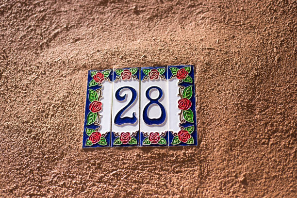istock Ceramic Number 28 Street Address Tiles; Brown Wall 1162625562