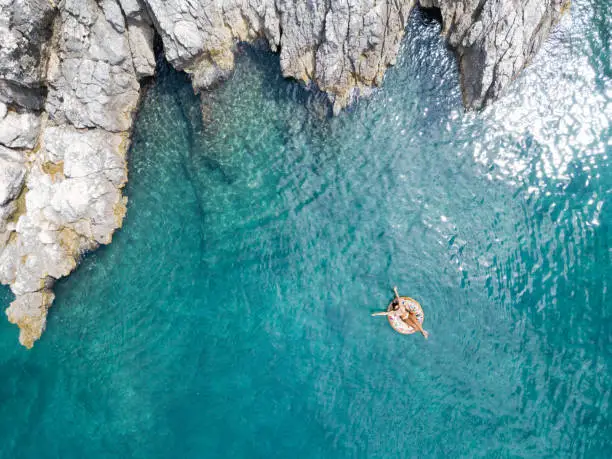 Woman swimming in beautiful clear water