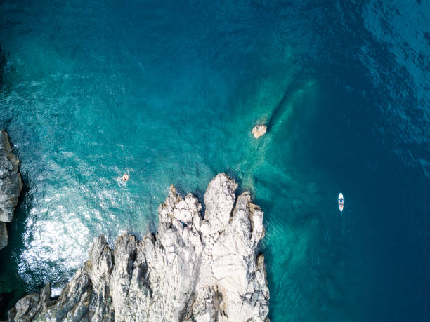 istock Beautiful coastline with lone rock from above 1162625869