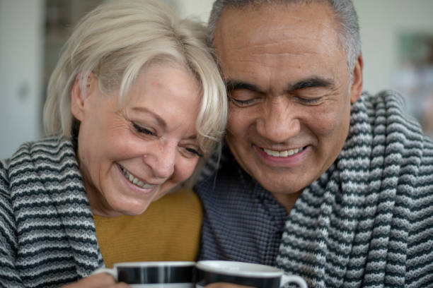 istock Baby boomers hugging on the couch 1162626651