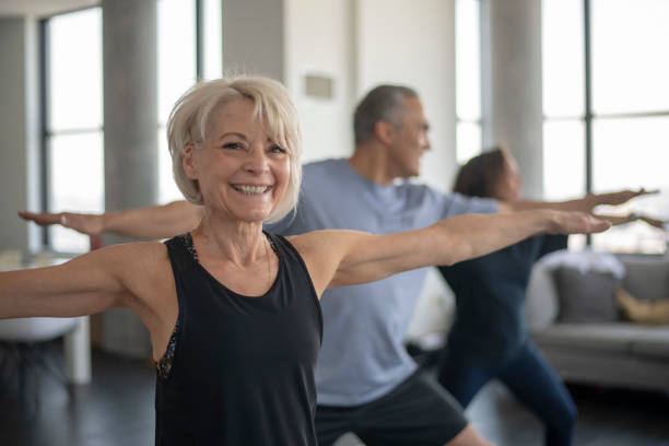 istock Baby boomers - at home yoga class 1162626671