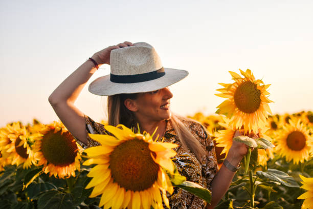istock Girl in sunflowers 1162626952