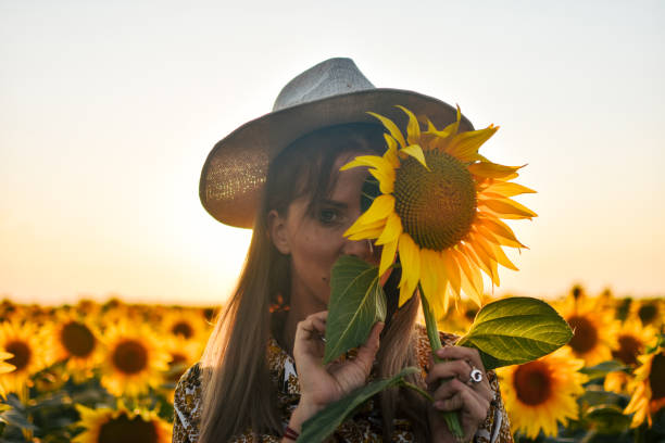 istock Girl in sunflowers 1162627868