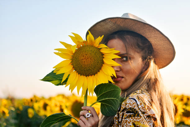 istock Girl in sunflowers 1162627869