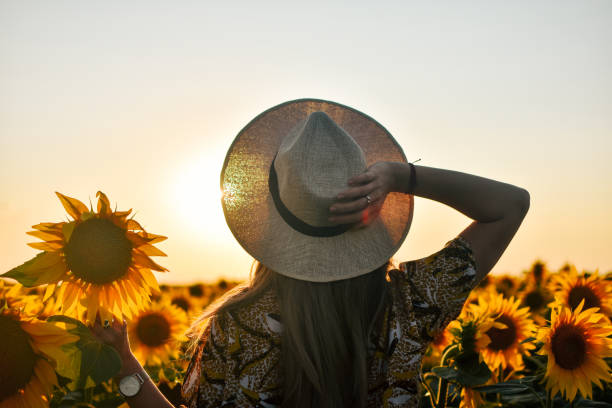 istock Girl in sunflowers 1162627932