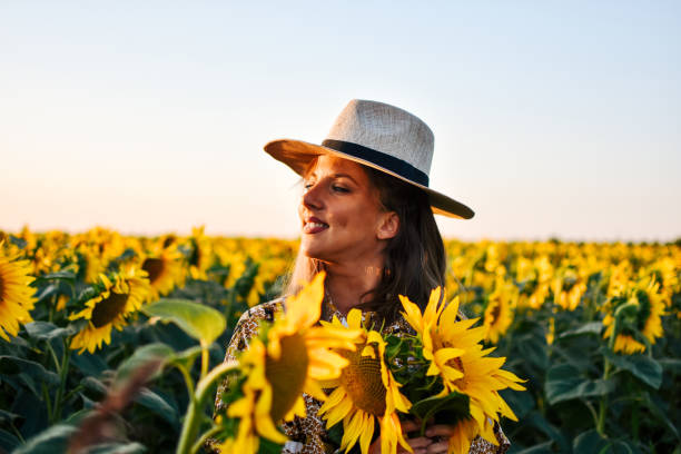 istock Girl in sunflowers 1162629342
