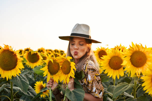 istock Girl in sunflowers 1162629495