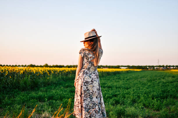 istock Beautiful woman in a meadow 1162630031
