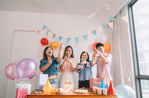 birthdaya group of friends celebrating an asian chinese female colleague birthday celebration